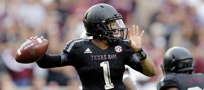 In this Oct. 31 photo, Texas A&M quarterback Kyler Murray throws against South Carolina in College Station, Texas. Following the season, Murray left the team. He signed with Oklahoma on Thursday.