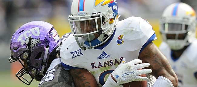 Kansas' Fish Smithson (9) comes up with a interception in the second half of the Jayhawks' 23-17 loss to TCU on Saturday, Nov. 14, 2015, in Fort Worth, Texas.
