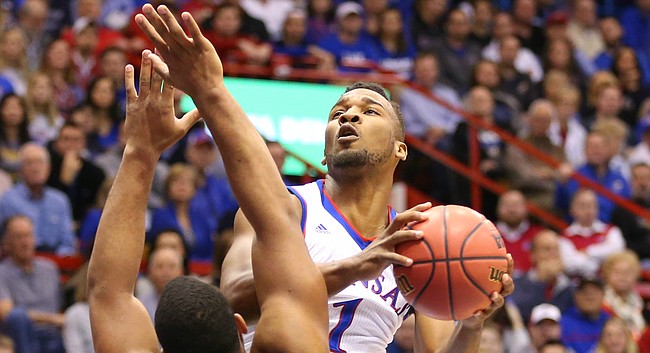 Kansas guard Wayne Selden Jr. (1) hangs for a shot over Baylor forward Rico Gathers (2) during the first half, Saturday, Jan. 2, 2016 at Allen Fieldhouse.