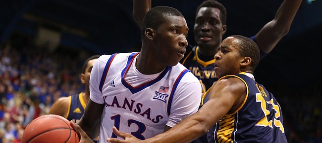Kansas forward Cheick Diallo (13) looks for an outlet as he is defended by UC Irvine forward Brandon Smith (13) and center Mamadou Ndiaye (34) during the second half, Tuesday, Dec. 29, 2015 at Allen Fieldhouse.