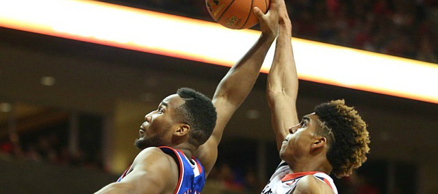 Kansas guard Wayne Selden Jr. (1) has a dunk attempt stuffed by Texas Tech forward Justin Gray (5) during the first half, Saturday, Jan. 9, 2016 at United Spirit Arena in Lubbock, Texas.