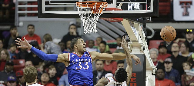 Kansas forward Landen Lucas (33) rejects a shot by Texas Tech guard Keenan Evans (12) but is called for a foul during the first half, Saturday, Jan. 9, 2016 at United Spirit Arena in Lubbock, Texas.