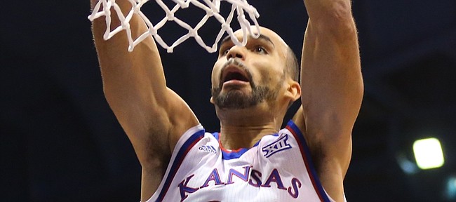 Kansas forward Perry Ellis (34) delivers a dunk during the second half, Friday, Nov. 13, 2015 at Allen Fieldhouse.
