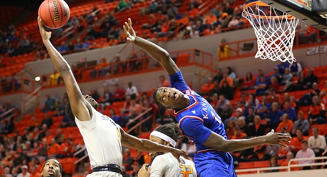 Kansas forward Cheick Diallo (13) loses a rebound to Oklahoma State guard Jawun Evans (1) during the first half, Tuesday, Jan. 19, 2016 at Gallagher-Iba Arena in Stillwater, Okla.