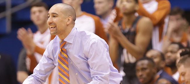 Texas head coach Shaka Smart directs his defense during the second half, Saturday, Jan. 23, 2016 at Allen Fieldhouse.