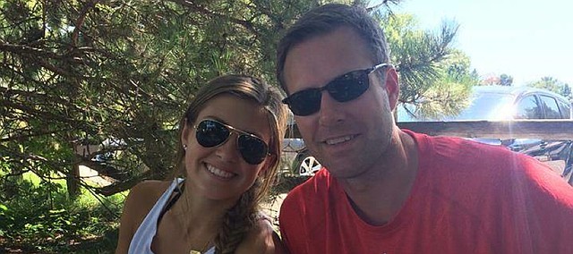 Paige Hoiberg, left, a Kansas University freshman who works in KU’s basketball office, poses for a picture with her dad, former Iowa State/current Chicago Bulls coach Fred Hoiberg. Despite ties to both programs, Paige Hoiberg says she’ll try to appear neutral when they meet Monday in Ames, Iowa.
