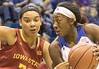 Kansas sophomore Chayla Cheadle, right, looks for a path to the basket around Iowa State's Meredith Burkhall (32)  during their game Tuesday evening at Allen Fieldhouse.