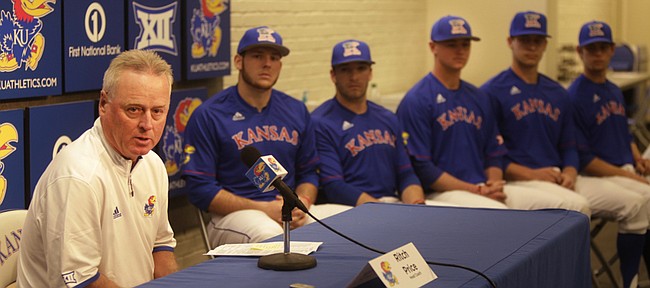 KU baseball coach Ritch Price talks about this year's team as a few team members listen in as KU held its media day on Wednesday, Feb. 17, 2016.