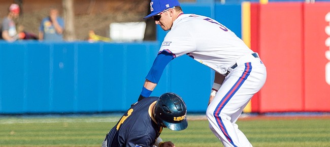 Northern Colorado senior Jacob Ek is caught trying to steal second base by Kansas sophomore shortstop Matt McLaughlin during the Jayhawks' home opener at Hoglund Ballpark on Monday. The teams square off again tomorrow, the first pitch is scheduled for 3 p.m.