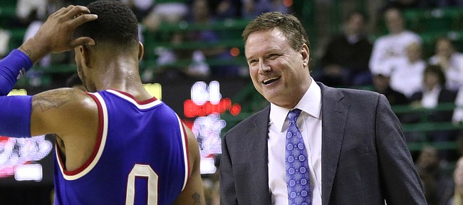 Kansas head coach Bill Self has a laugh with Kansas guard Frank Mason III (0) as time begins to expire in the Jayhawks' 66-60 win over Baylor, Tuesday, Feb. 23, 2016 at Ferrell Center in Waco, Texas.