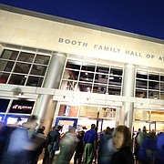 Fans file through the doors of Allen Fieldhouse past the statue of Phog Allen in this file photo from Monday, Oct. 27, 2014.
