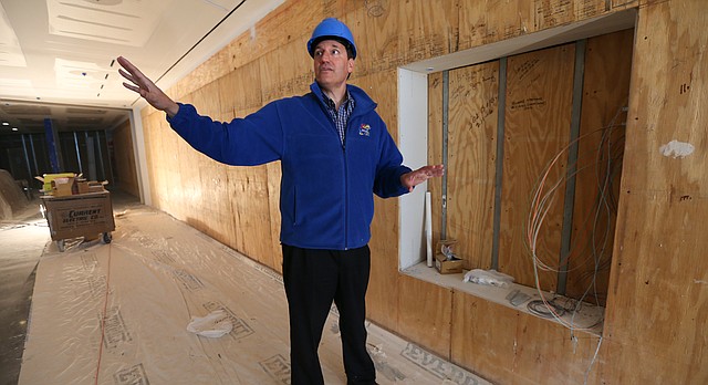 Curtis Marsh, director of the DeBruce Center, discusses some of the features planned for the "Rules Gallery" while standing next to the space where James Naismith's original rules of "Basket Ball" will be housed and on display for the public, during a walking tour of the facility on Thursday, Feb. 25, 2016.