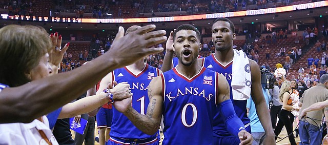 Kansas guard Frank Mason III (0), left and Wayne Selden Jr. right, come off the court after an 86-56 win over the Longhorns Monday, Feb. 29, 2016 at the Frank Erwin Center in Austin, Texas. 
