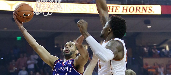 Kansas forward Perry Ellis drives to the basket for two of his 15 first-half points against Texas in a game Monday, Feb. 29, 2016 at the Frank Erwin Center in Austin, Texas. 