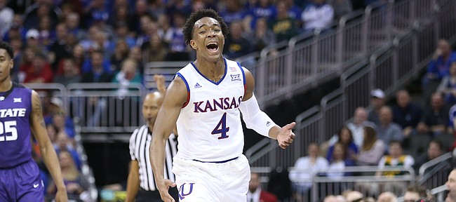 Kansas guard Devonte' Graham (4) reacts to being called for a foul after stripping the ball from Kansas State forward Wesley Iwundu (25) during the first half, Thursday, March 10, 2016 at Sprint Center in Kansas City, Mo.