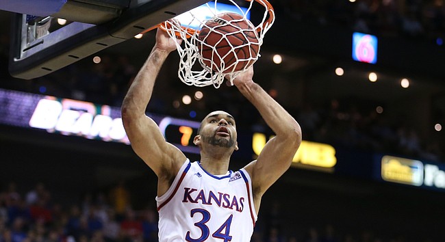Kansas forward Perry Ellis (34) comes in for a jam off of a lob during the first half, Friday, March 11, 2016 at Sprint Center in Kansas City, Mo.