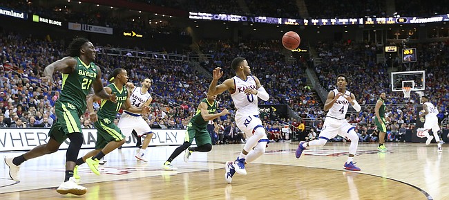 The Jayhawks scramble to get the ball in as it is inbounded to Kansas guard Devonte' Graham (4) with 20 seconds remaining in regulation Friday, March 11, 2016 at Sprint Center in Kansas City, Mo.