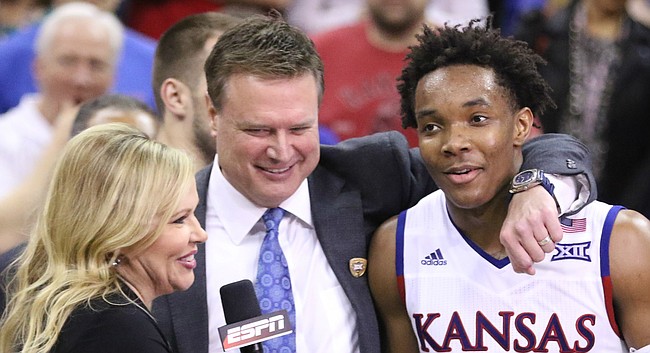 Kansas head coach Bill Self puts his arm around guard Devonte' Graham (4) during the postgame interview with Holly Rowe of ESPN.