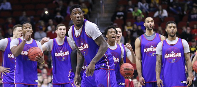 Kansas forward Jamari Traylor (31) and the Jayhawks react after Traylor broke a fixture on the shot clock while  attempting a half-court shot during practice on Wednesday, March 16, 2016 at Wells Fargo Arena in Des Moines, Iowa. The Jayhawks will take on the Governors Thursday.