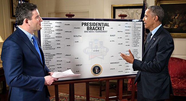 President Barack Obama makes his picks for the 2016 NCAA Men's Basketball Tournament as part of a segment with ESPN's Andy Katz, left.