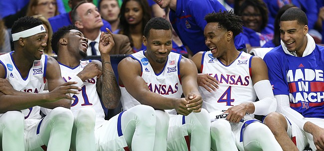Players on the Kansas bench have a laugh with the game locked up late in the second half, Thursday, March 17, 2016 at Wells Fargo Arena in Des Moines, Iowa.