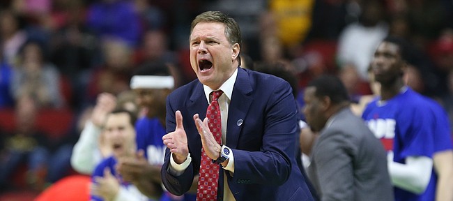 Kansas head coach Bill Self applauds the Jayhawks as they widen their lead during the second half on Saturday, March 19, 2016 at Wells Fargo Arena in Des Moines.
