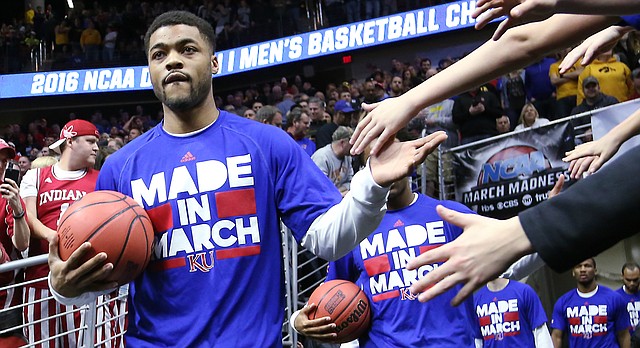 Frank Mason III leads the Jayhawks onto the court for their game against the Connecticut Huskies Saturday, March 19, 2016 in a 2nd round NCAA tournament game at Wells Fargo Arena in Des Moines, IA. 
