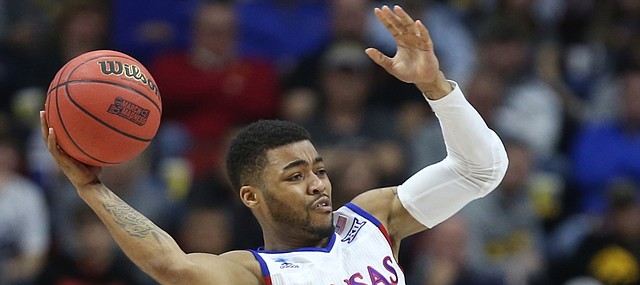 Kansas guard Frank Mason III (0) looks to throw a pass over Connecticut guard Sterling Gibbs (4) during the second half on Saturday, March 19, 2016 at Wells Fargo Arena in Des Moines.