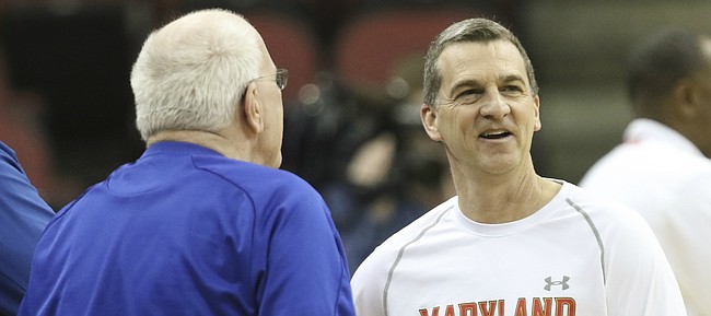 Maryland head coach Mark Turgeon laughs with Kansas radio broadcaster Bob Davis during practice on Wednesday, March 23, 2016 at KFC Yum! Center in Louisville, Kentucky.