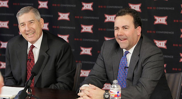 Big 12 commissioner Bob Bowlsby, left, and Kansas athletic director Sheahon Zenger laugh while taking reporters' questions after the first day of the conference's meeting Thursday, Feb. 4, 2016, in Irving, Texas. (AP Photo/LM Otero)