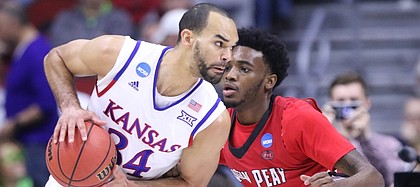 Kansas forward Perry Ellis (34) looks to make a move against Austin Peay forward Kenny Jones (42) during the first half, Thursday, March 17, 2016 at Wells Fargo Arena in Des Moines, Iowa.