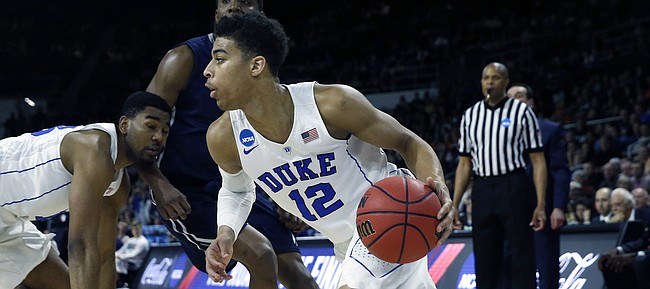 Duke's Derryck Thornton (12) drives for the basket during the second half against Yale in the second round of the NCAA men's college basketball tournament in Providence, R.I., Saturday, March 19, 2016. Duke won 71-64. (AP Photo/Michael Dwyer)