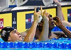 Michael Andrew reacts after winning his preliminary heat in the men's 100-meter breaststroke at the U.S. Olympic swimming trials, Sunday, June 26, 2016, in Omaha, Neb. (AP Photo/Mark J. Terrill)