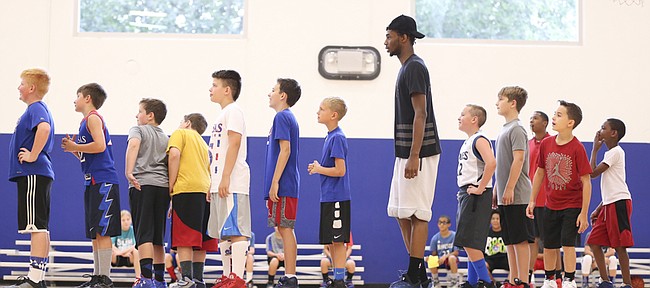 Minnesota Timberwolves guard and former Kansas star Andrew Wiggins waits in line with the campers for his turn to shoot during his and Ben McLemore's Kansas All-Star Basketball Camp on Thursday, July 14, 2016 at Sports Pavilion Lawrence.