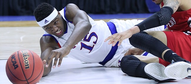 Kansas forward Carlton Bragg Jr. (15) dives for a loose ball in the Jayhawks win against the Austin Peay Governors Thursday, March 17, 2016 at Wells Fargo Arena in Des Moines, IA. 