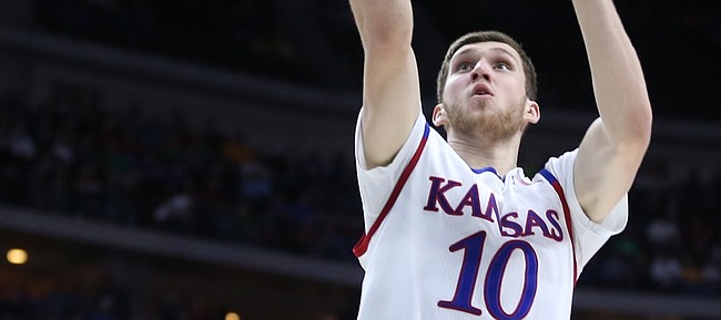 Kansas guard Sviatoslav Mykhailiuk (10) gets to the bucket past Austin Peay guard Khalil Davis during the second half, Thursday, March 17, 2016 at Wells Fargo Arena in Des Moines, Iowa.