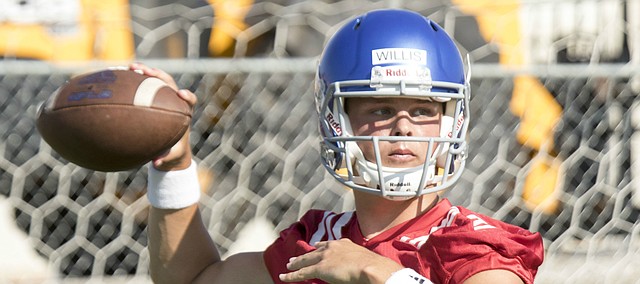 Kansas sophomore quarterback Ryan Willis throws passes during practice on Thursday, Aug. 4, 2016.