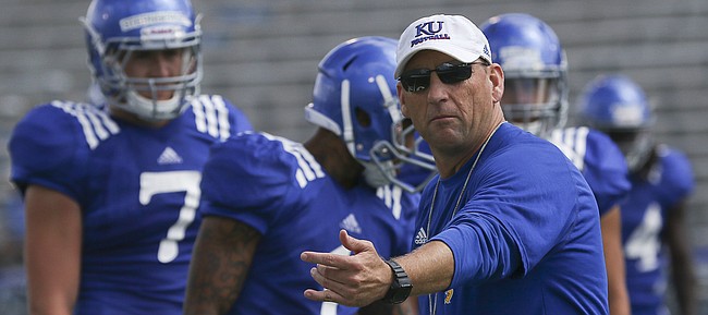 Kansas football coach David Beaty gives out instruction during a drill in KU's Fan Appreciation Day practice on Saturday, August 20th at Memorial Stadium. 