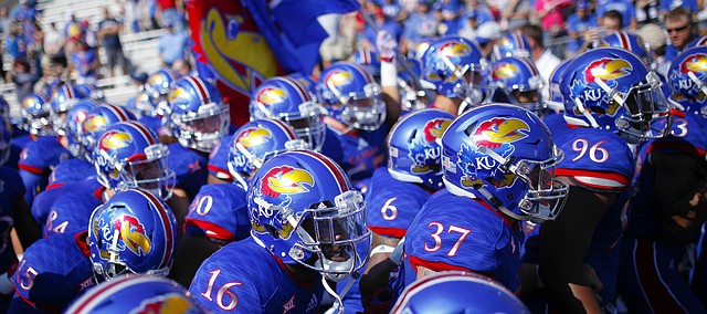 The Jayhawks pack it in tight as they prepare to rush onto the field before kickoff on Saturday, Sept. 5, 2015 at Memorial Stadium.