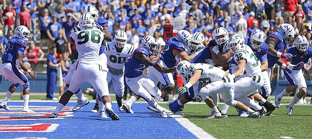 Kansas running back Ke'aun Kinner (22) is stopped in the end zone by Ohio linebacker Austin Clack (36) for a safety during the first quarter on Saturday, Sept. 10, 2016 at Memorial Stadium.