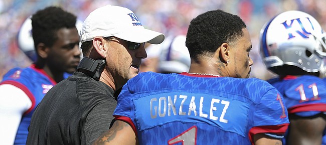Kansas head coach David Beaty gives a pat on the back to Kansas wide receiver LaQuvionte Gonzalez (1) after Gonzalez fumbled a punt during the second quarter on Saturday, Sept. 10, 2016 at Memorial Stadium.