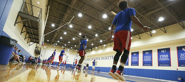Kansas guard Devonte Graham, right, wields a jump rope with his teammates during Boot Camp in the practice gym on Friday, Sept. 23, 2016 just after 6 a.m.