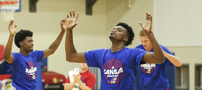 Kansas players Dwight Coleby, left, Josh Jackson and Lagerald Vick perform "boxes" during Boot Camp in the practice gym on Friday, Sept. 23, 2016 just after 6 a.m.