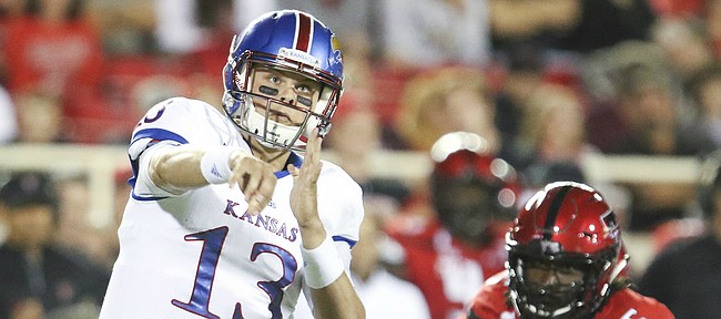 Kansas quarterback Ryan Willis (13) heaves a pass to the flat during the fourth quarter on Thursday, Sept. 29, 2016 at Jones AT&T Stadium in Lubbock, Texas.