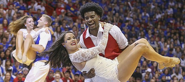 Kansas guard Josh Jackson spins his dancing partner during the "Dancing With the Jayhawks" portion of Late Night in the Phog on Saturday, Oct. 1, 2016 at Allen Fieldhouse.