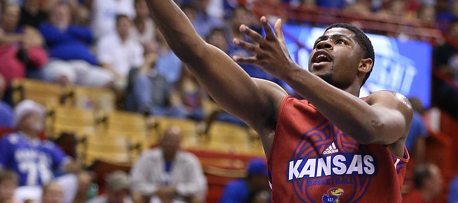 Kansas guard Malik Newman gets in for a bucket past Clay Young during Late Night in the Phog on Saturday, Oct. 1, 2016 at Allen Fieldhouse.