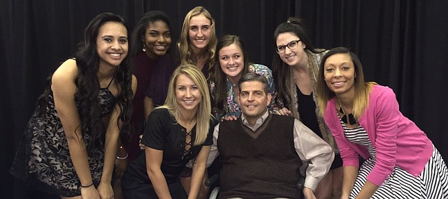 Members of the 2016 Kansas volleyball team pose with academic advisor Scott "Scooter" Ward. On Friday, Oct. 7, Ward suffered a tear of his aorta and was rushed into surgery, prompting several members of the KU volleyball and men's basketball teams to send out thoughts and prayers for one of the most popular and well-liked members of either program. 
