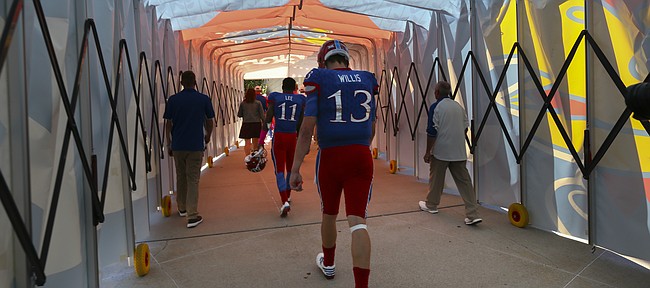 Kansas quarterback Ryan Willis (13) walks through the tunnel to the locker room following the Jayhawks' 24-23 heartbreaking loss to TCU on Saturday, Oct. 8, 2016 at Memorial Stadium.