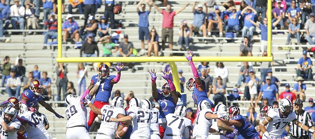 TCU place kicker Brandon Hatfield (27) puts a field goal up over the Kansas defense and through the uprights to give the Horned Frogs the lead late in the fourth quarter on Saturday, Oct. 8, 2016 at Memorial Stadium.