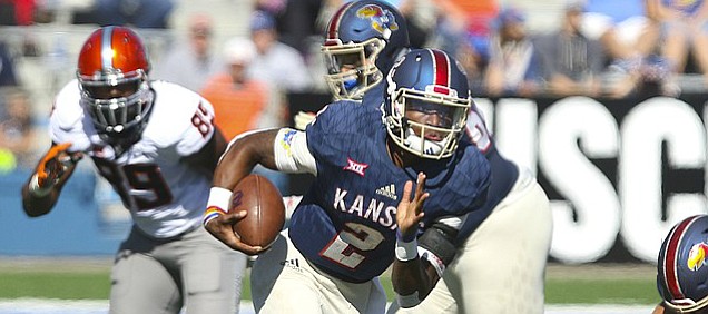 Kansas quarterback Montell Cozart (2) takes off on a run during the second quarter on Saturday, Oct. 22, 2016 at Memorial Stadium.